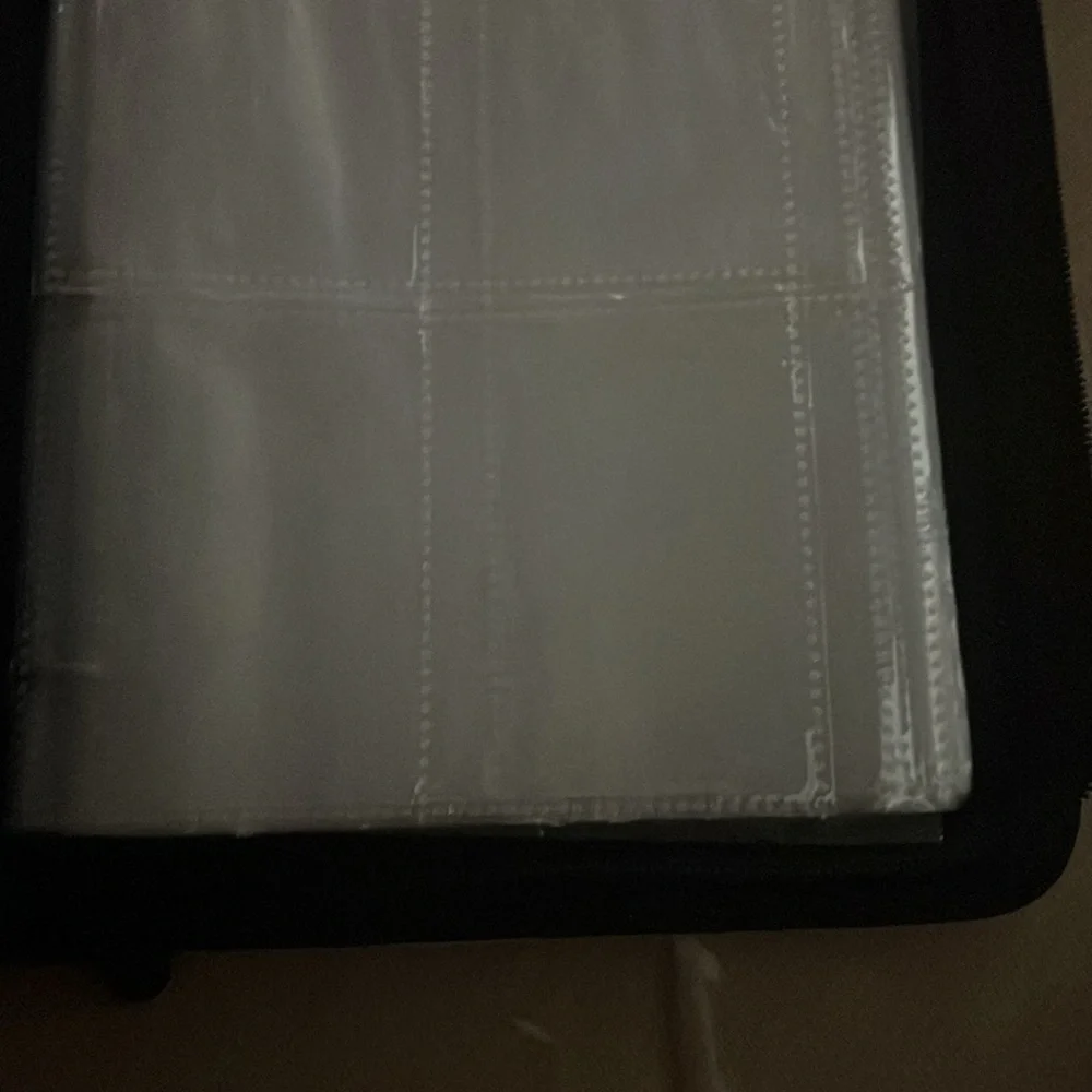Pink and White Pokémon book to put the cards